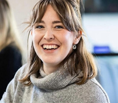 A close-up of a woman smiling.