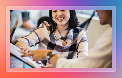 Woman sharing insights in a conference room to business people