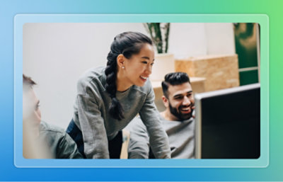 A group of people looking at the computer screen..