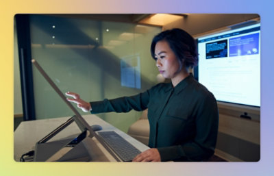 A woman using a touch screen.