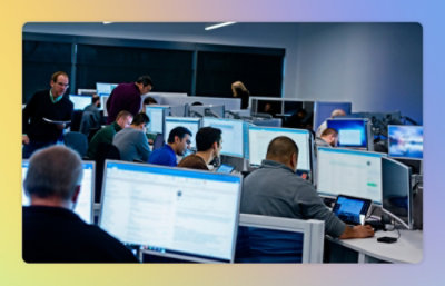 A group of people working on computers.