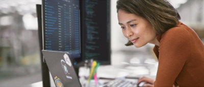 A woman looking at a computer screen.