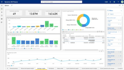 A person working on their laptop in a public space.