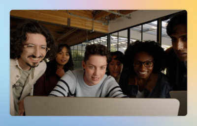 A group of people looking at a computer screen.