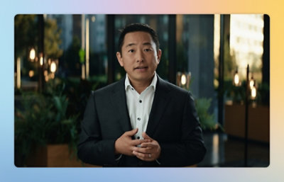 A man in a suit looking at the camera.