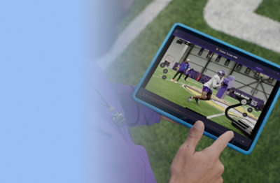 A person holding a tablet.