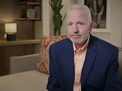 Executive seated in modern living room.
