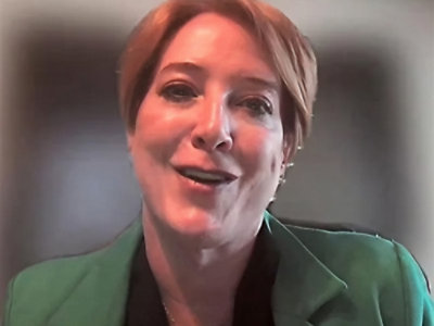 Professional speaking in virtual interview setting.