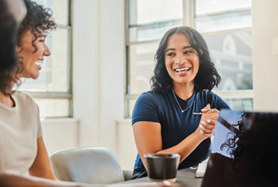 A group of people sitting at a table.