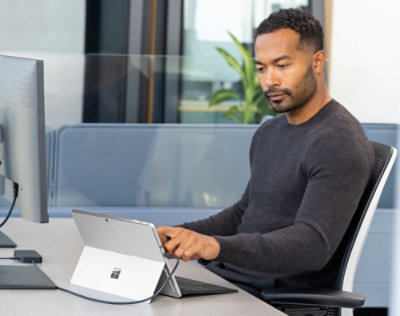 A man working on a laptop.