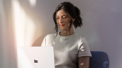 A women working on a laptop.