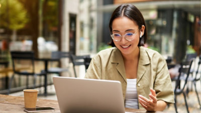A woman working on a laptop.