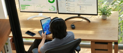 A man holding tablet and working