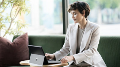 A woman working on a laptop.