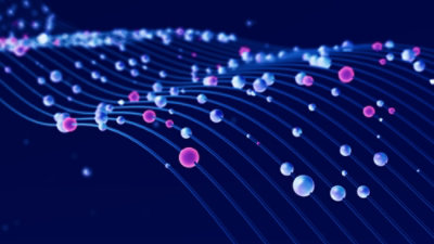 A man is sitting on the chair in front of computer