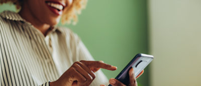 A woman looking at a phone.