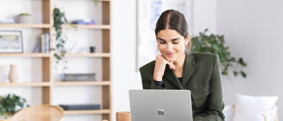 A women looking at a laptop.