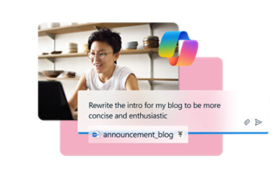 A woman in a white shirt using a laptop with text Copilot on the screen.