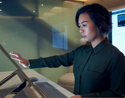A women looking into screen and scrolling.