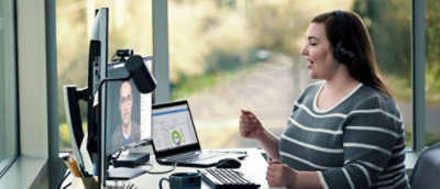 A woman working with desktop