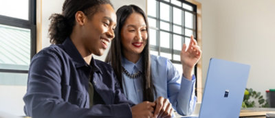 A man and woman smiling.