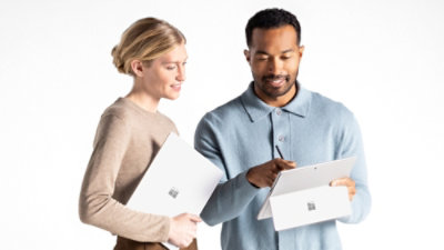 A person holding a white folder.