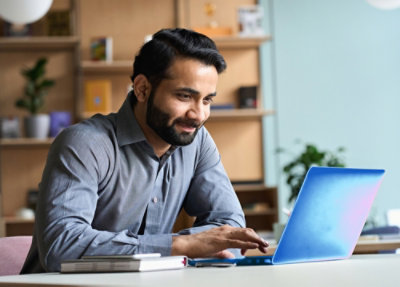 A man working on a laptop.