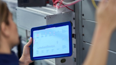A person holding a tablet.
