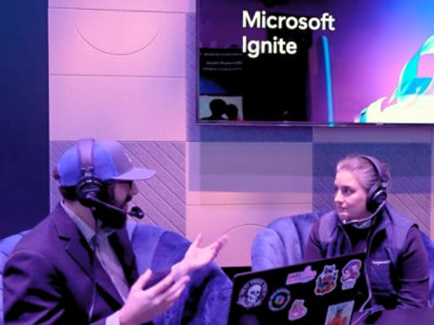 A man and woman sitting in chairs.