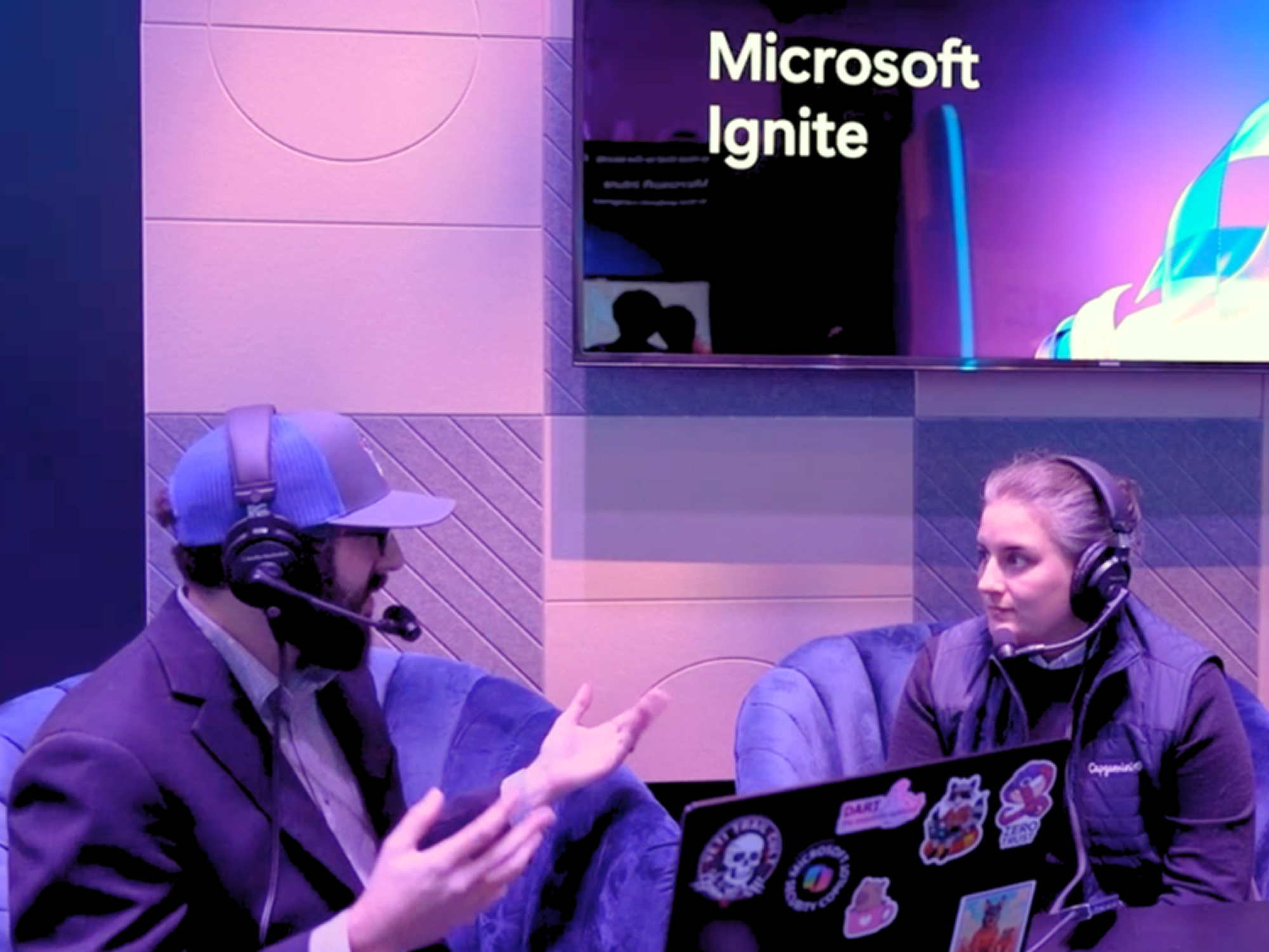 A man and woman sitting in chairs.