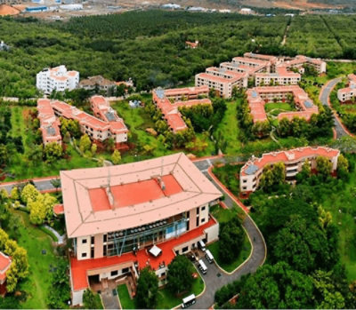 A high-angle view of a building with trees in the background.