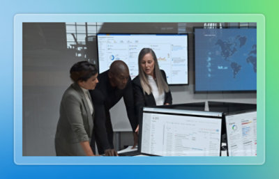 A group of people looking at a computer screen.