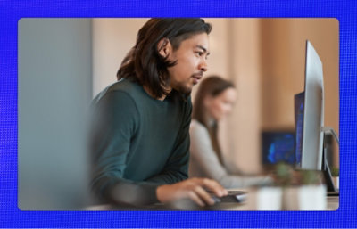 A person looking at a computer screen.