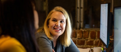 Two womens disscussing to each other.