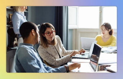 Man and women working on laptop.