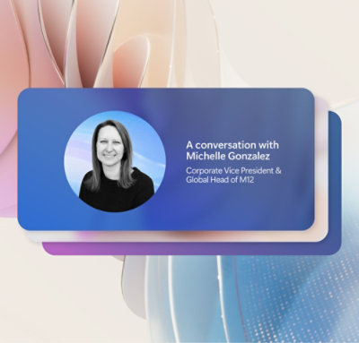 A women wearing a black top with a smile on her face.