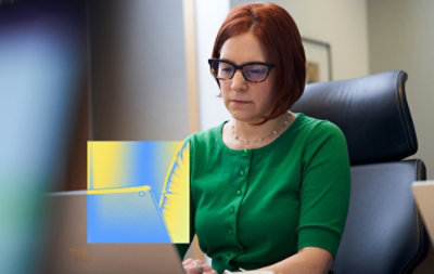 Person working on laptop at desk