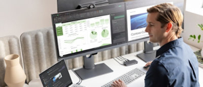 A computer monitor with a screen showing graphs and charts.