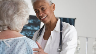 A Doctor talking to her patient.