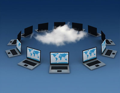 Nine laptops arranged in a circle display world maps on their screens