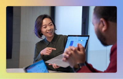 A person pointing at a laptop.