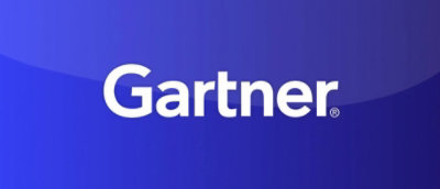 A blue sign with white text reading Gartner® and a black border.