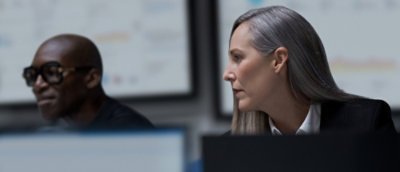 A man and woman looking at each other.
