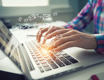 A person typing on a laptop.