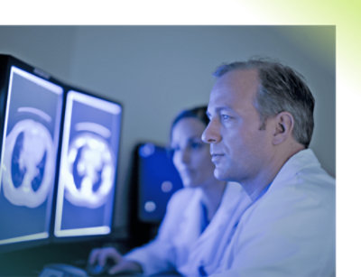 A few doctors looking at a computer screen.
