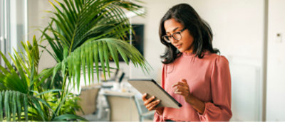 A girl holding a tablet.
