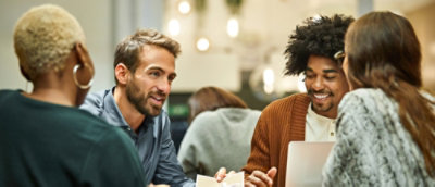 A group of people sitting at a table.