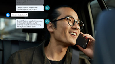 A man wearing glasses talking on a cell phone.