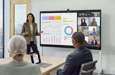 A woman giving a presentation to a group of people.