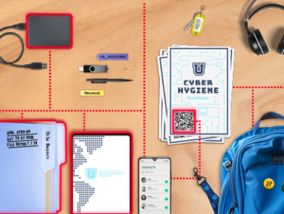 A laptop, a blue backpack with a yellow button, and a school bag with other supplies.